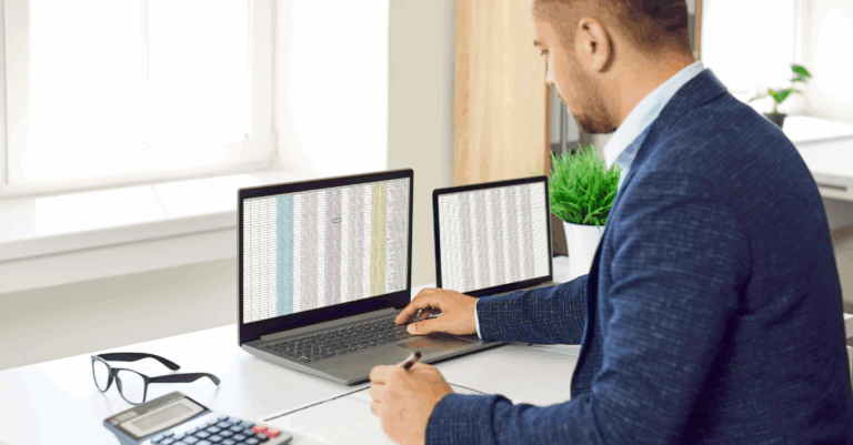 person looking at excel sheets